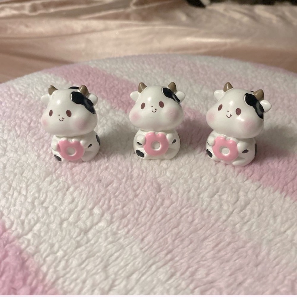 kawaii cow holding a pink donut croc charms